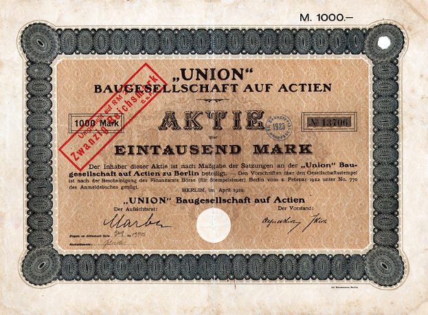 Alter deutscher Banknote mit rotem Stempel und Text, wahrscheinlich eine Aktienurkunde.