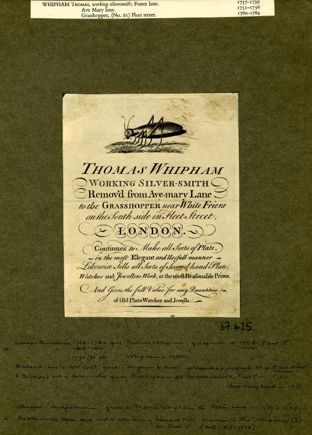 Altes Buch mit einer Zeichnung eines Grashüpfers auf dem Cover, das Text auf den Seiten enthält.